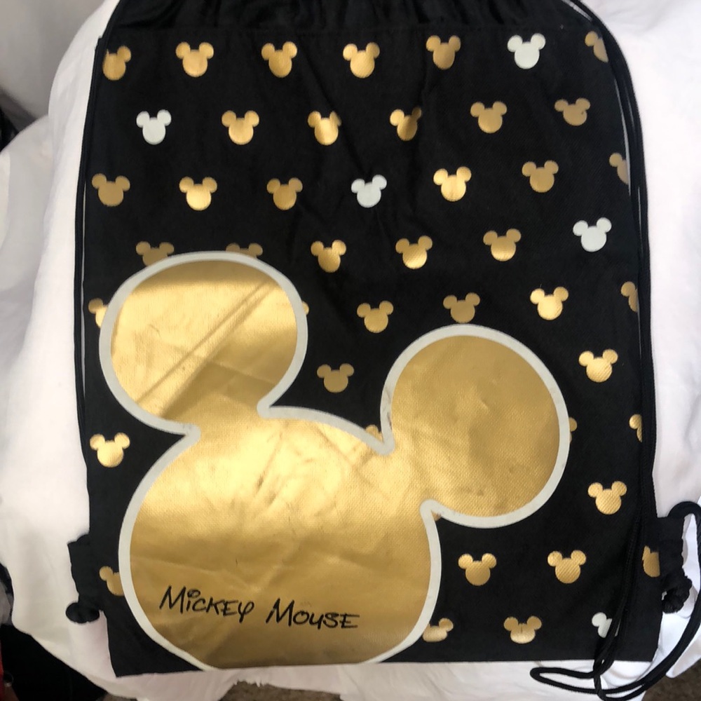 DISNEY Mickey Mouse black, gold, and white nylon drawstring knapsack.